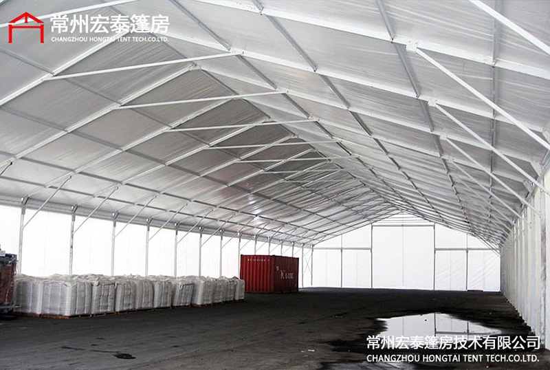 What factors should be considered when building a large warehouse tent?